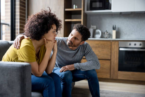 A couple supporting one another through a difficult time